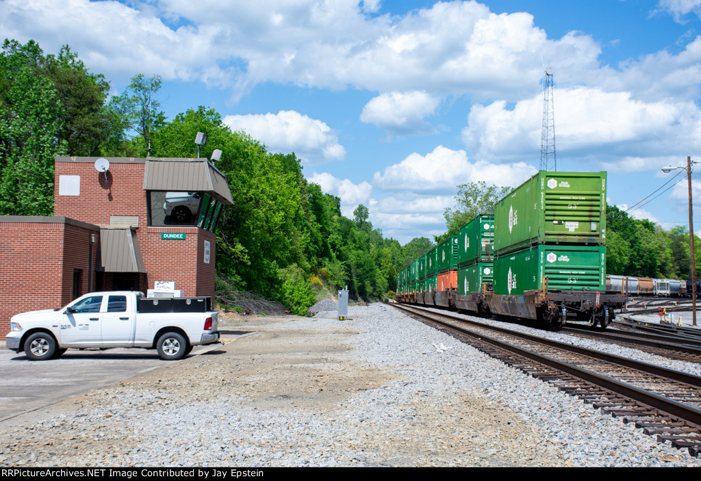 Intermodal cars pass the Dundee Yard Tower 